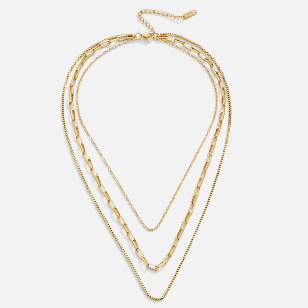 Miela Layered Chain Necklace, three gold chains layered in a V shape, flat on a white background