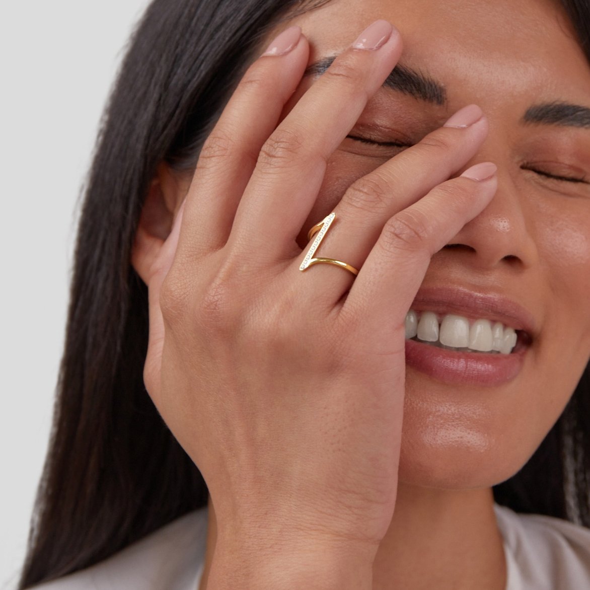 Mila Twisted Gold Ring, worn on a hand covering the face, gold ring with angled bar