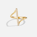 Mila Twisted Gold Ring, standing ring on white background, gold with a row of clear stones