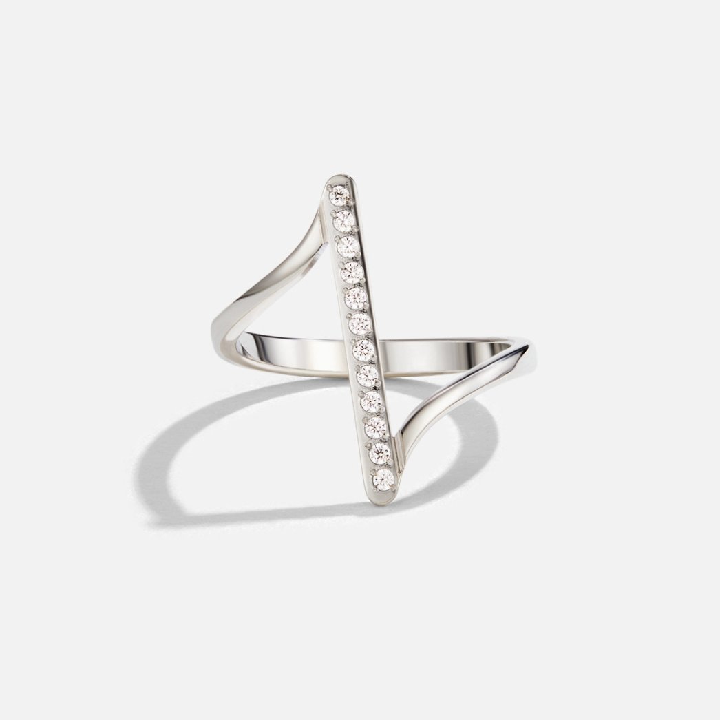 Mila Twisted Silver Ring, standing ring on white background, diagonal bar set with small stones