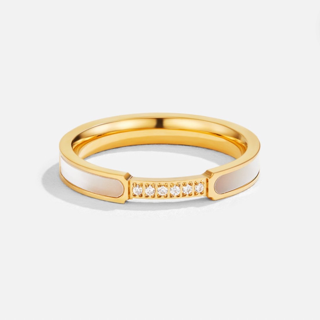 Mother Of Pearl & Crystal Ring, standing upright on white, gold band with pearl inlays and