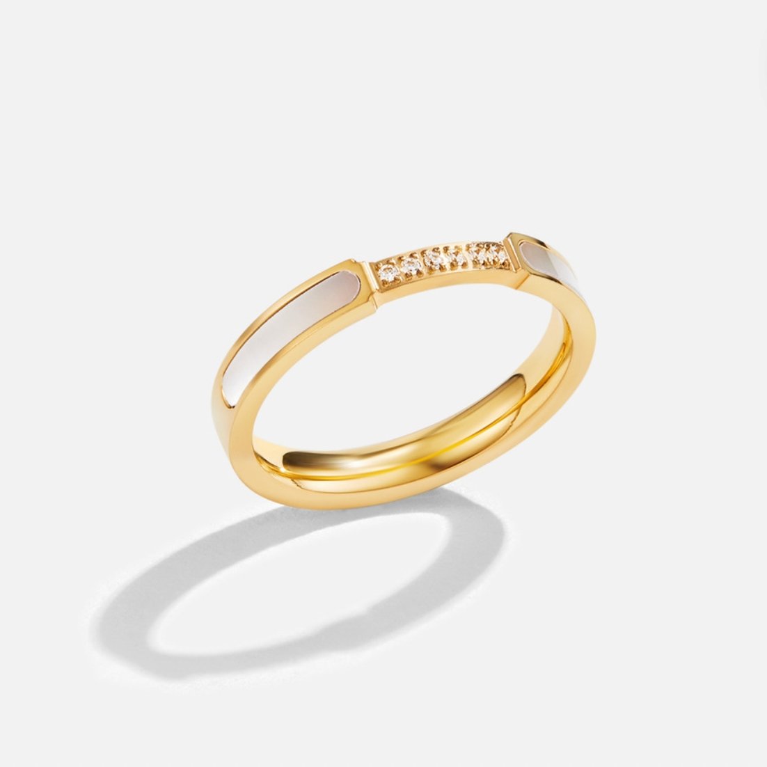 Mother Of Pearl & Crystal Ring, standing ring on white background, gold band with pearl inlays