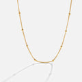 Niyah Bead Gold Chain Necklace, gold chain with small evenly spaced beads on white background