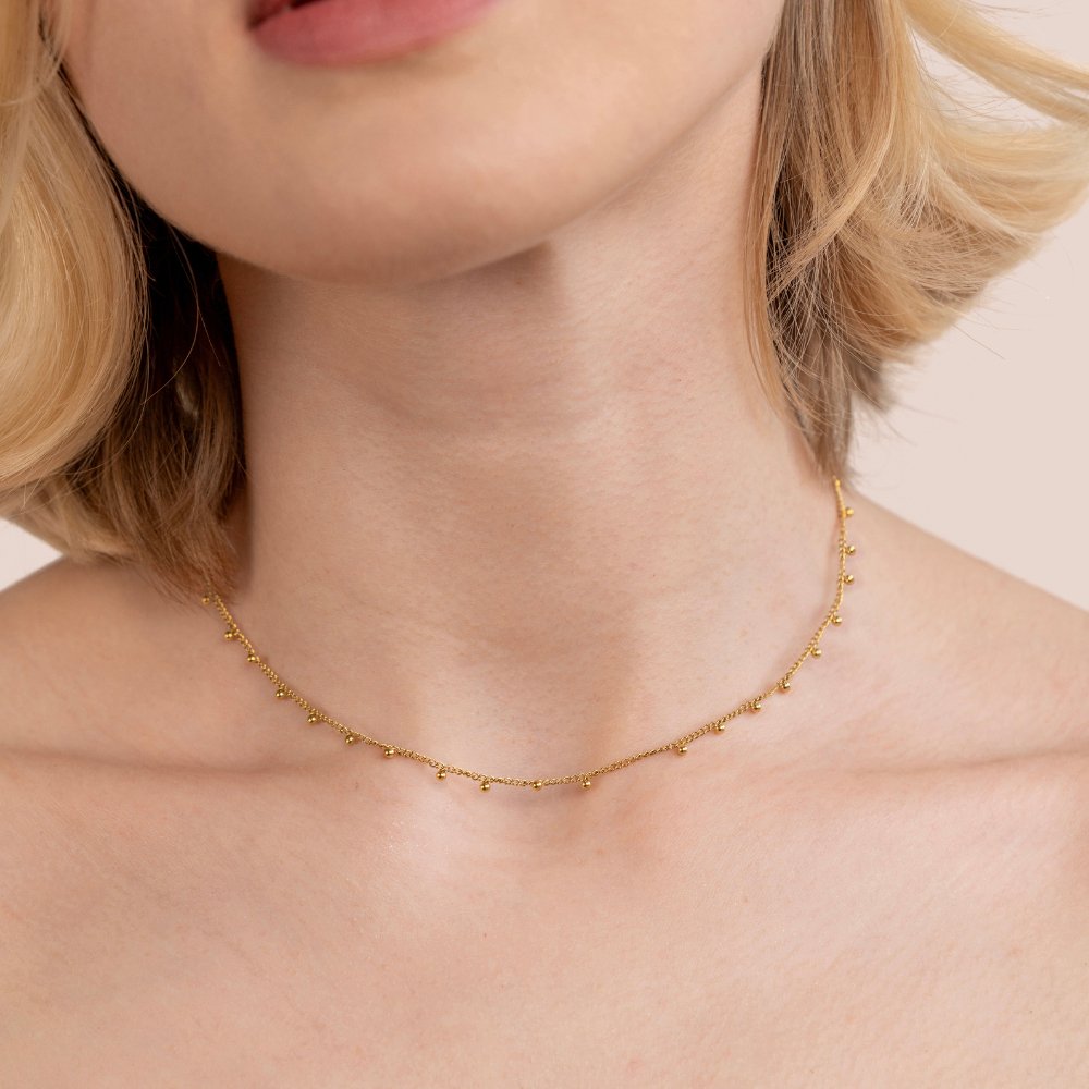 Nylah Bead Necklace, worn at the neck on a woman with short blonde hair