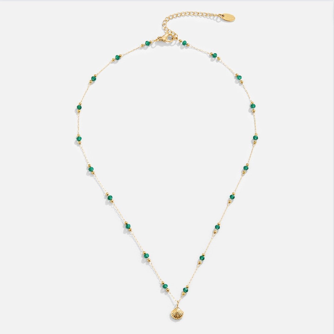 Ocean Lover Shell & Bead Necklace Set, flat lay of gold chain with green beads and shell pendant