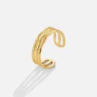 Ohio Layered Gold Ring, open-band gold ring standing upright on white, with wavy textured layers