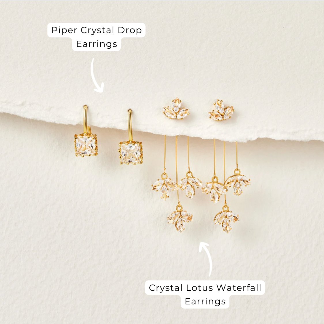Piper Crystal Drop Earrings, pair of gold drop earrings with square crystal stones, on paper