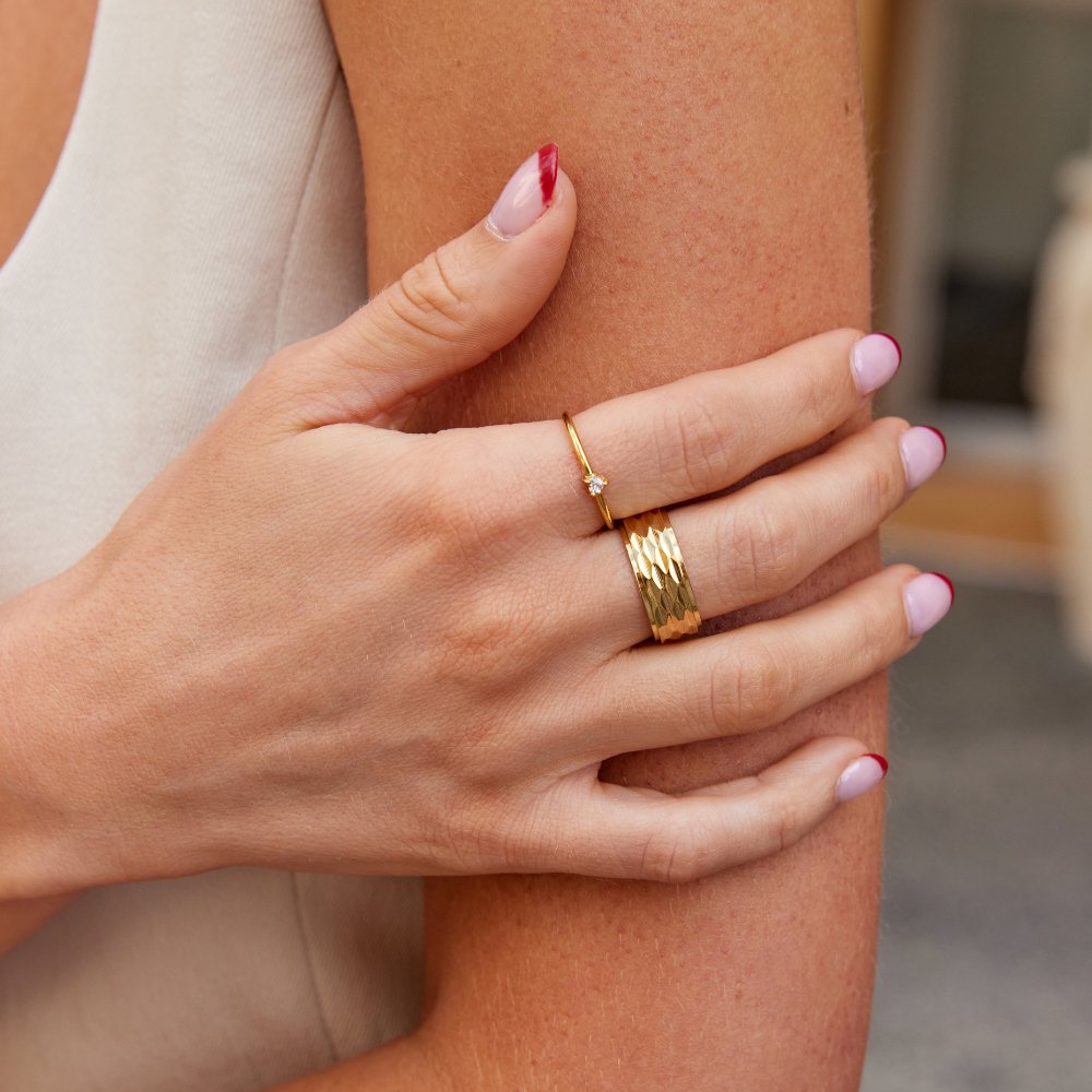 Rene Chunky Gold Ring, worn on a hand with a thin gold ring and a textured band