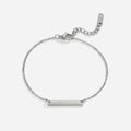 Rina Silver Bar Bracelet, flat lay of silver chain bracelet with plain bar charm and clasp