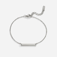 Rina Silver Bar Bracelet, flat lay of silver chain bracelet with plain bar charm and clasp