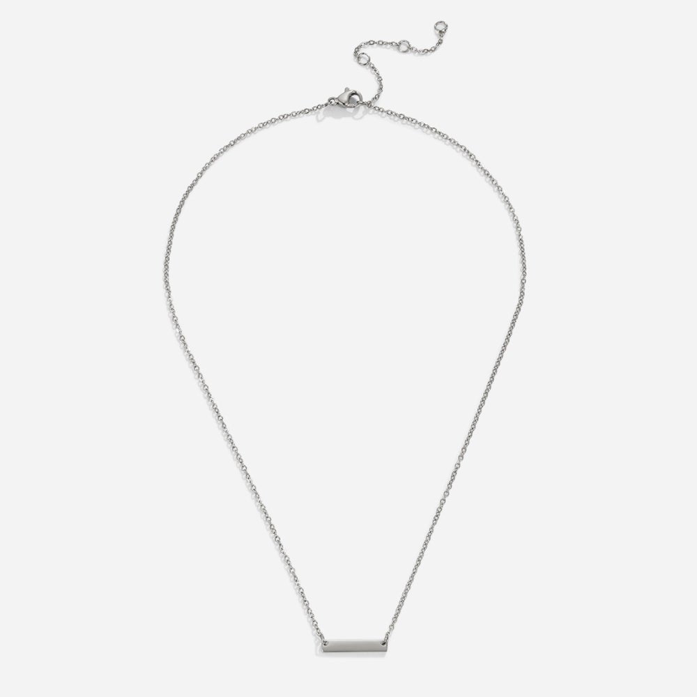 Rina Silver Bar Necklace, flat lay on white, thin chain with small silver bar pendant