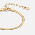 Sarya Snake Chain Gold Bracelet, gold herringbone bracelet laid flat, extender chain and oval tag