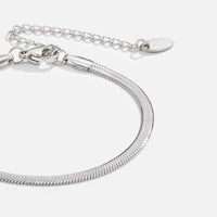 Sarya Snake Chain Silver Bracelet, close-up of a flat silver snake chain with clasp and extender