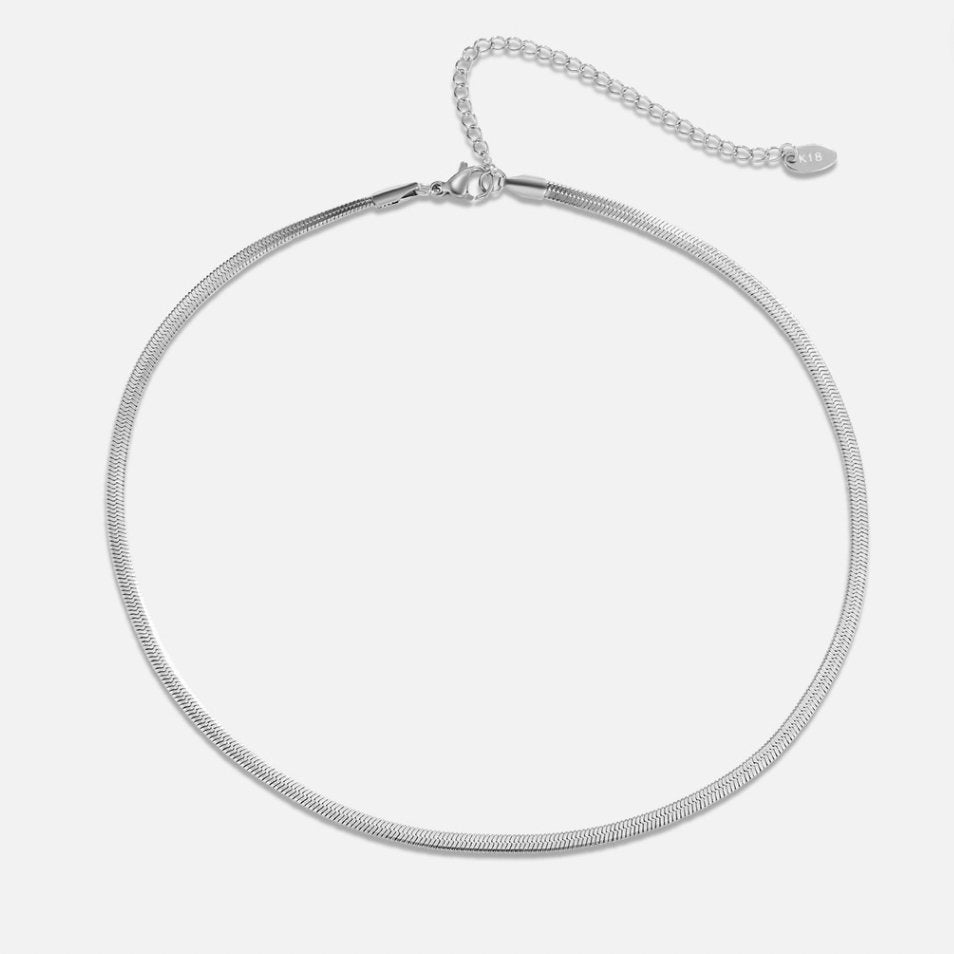 Sarya Snake Chain Silver Necklace, flat-lay on white, silver herringbone chain with extender tail