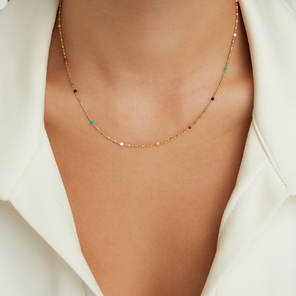 Sasha Multi-Colored Necklace, worn on a neck with a white open-collar shirt, multicolour beads