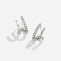 Silver & Crystal Claw Earrings, pair of silver earrings on white background, one with