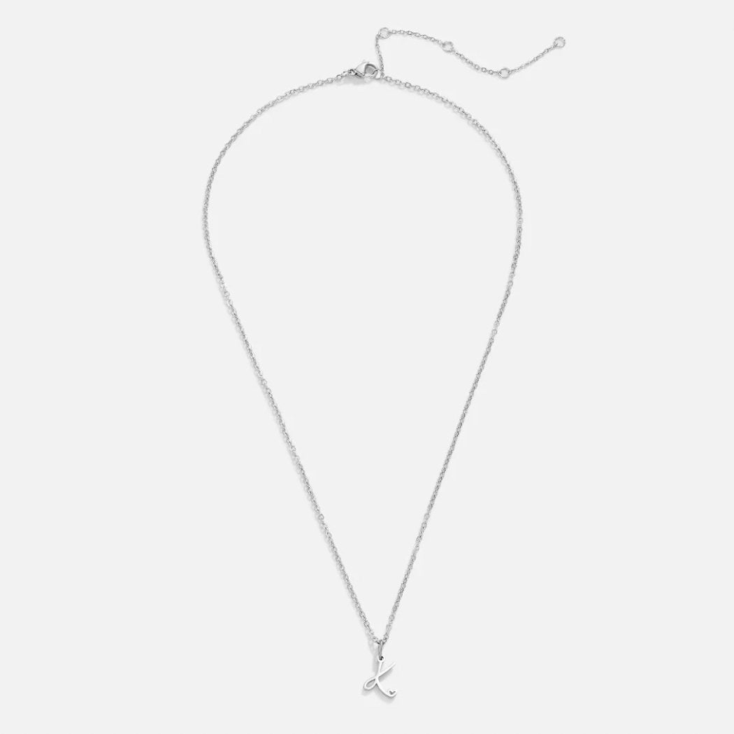 Silver Letter Heart Necklace, flat lay of a silver chain with a script letter pendant