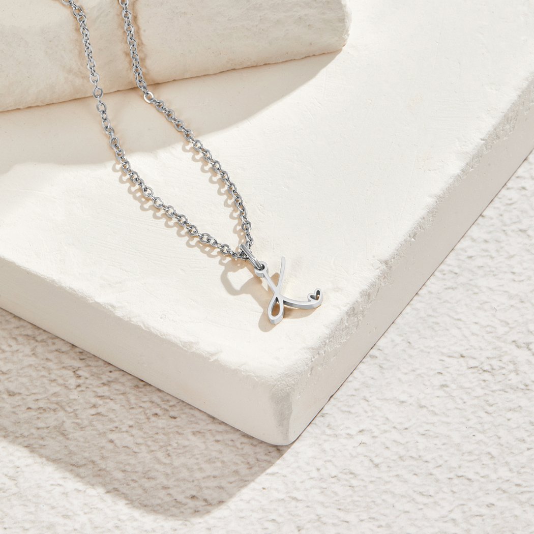 Silver Letter Heart Necklace, silver chain necklace with a script letter pendant on white stone