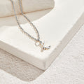 Silver Letter Heart Necklace, silver chain necklace with a script letter pendant on white stone