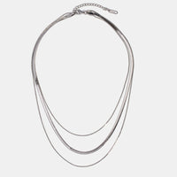 Silver Multi-Layered Chain Necklace, flat lay of three layered silver snake chains with a clasp