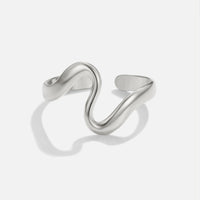 Silver Wave Ring, open wavy band on a plain white background, polished silver finish
