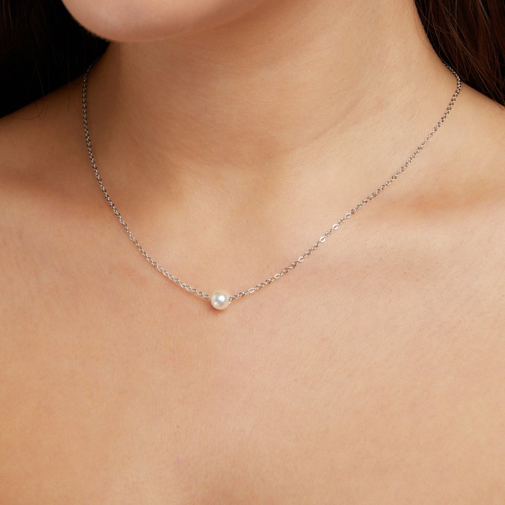 Solitaire Silver Pearl Necklace, worn at the neck with a single white pearl on a fine silver chain