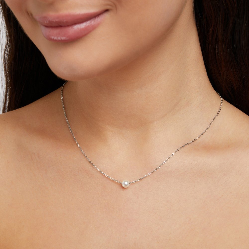 Solitaire Silver Pearl Necklace, worn on a model's neck, single pearl on a fine silver chain