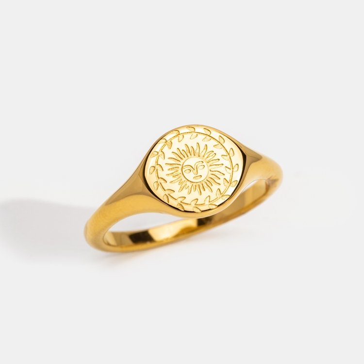 Summer Solstice Gold Ring, gold signet ring on white background, face engraved with a sun