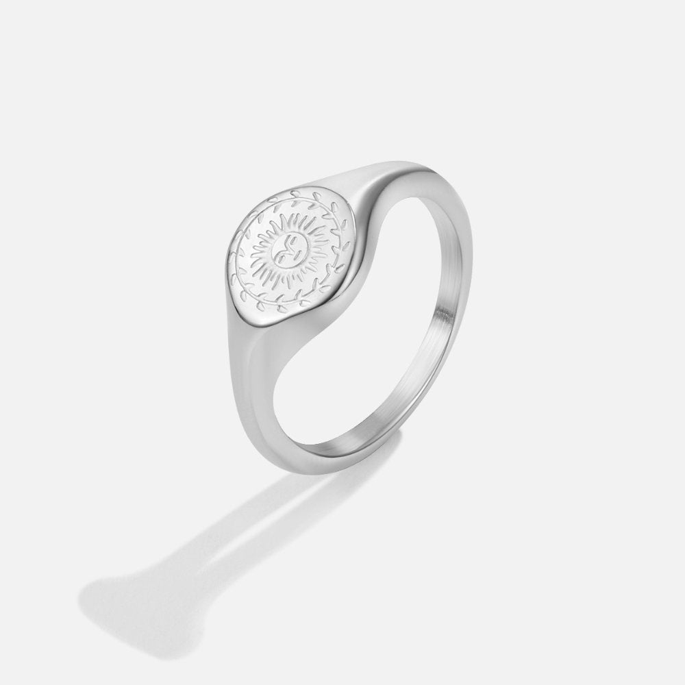Summer Solstice Silver Ring, silver signet ring with an engraved sun design on its oval face