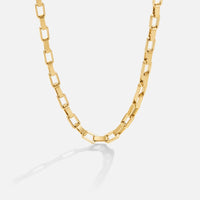 Venna Gold Chain Necklace, gold rectangular-link chain lying in a curve on a plain background