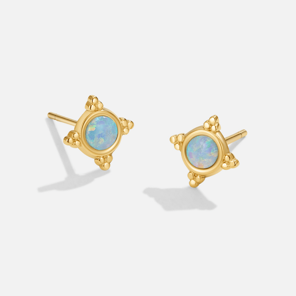Vintage Blue Opal Stud Earrings, pair of gold stud earrings with pale blue opal centres on white