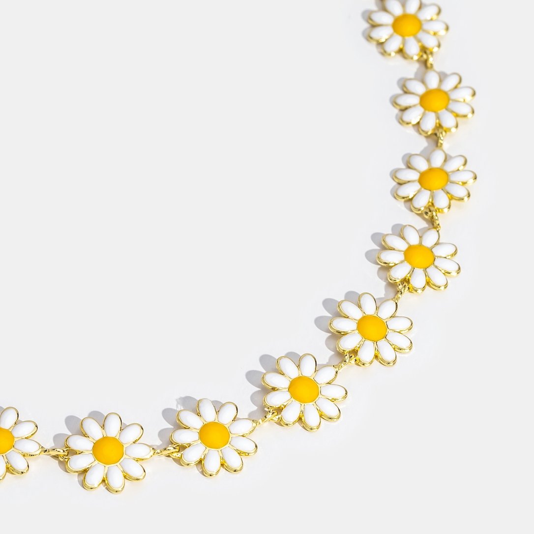 White Daisy Flower Necklace, flat close-up of daisy links on white background, gold chain